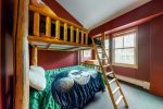 Guest bedroom with bunks and children`s games